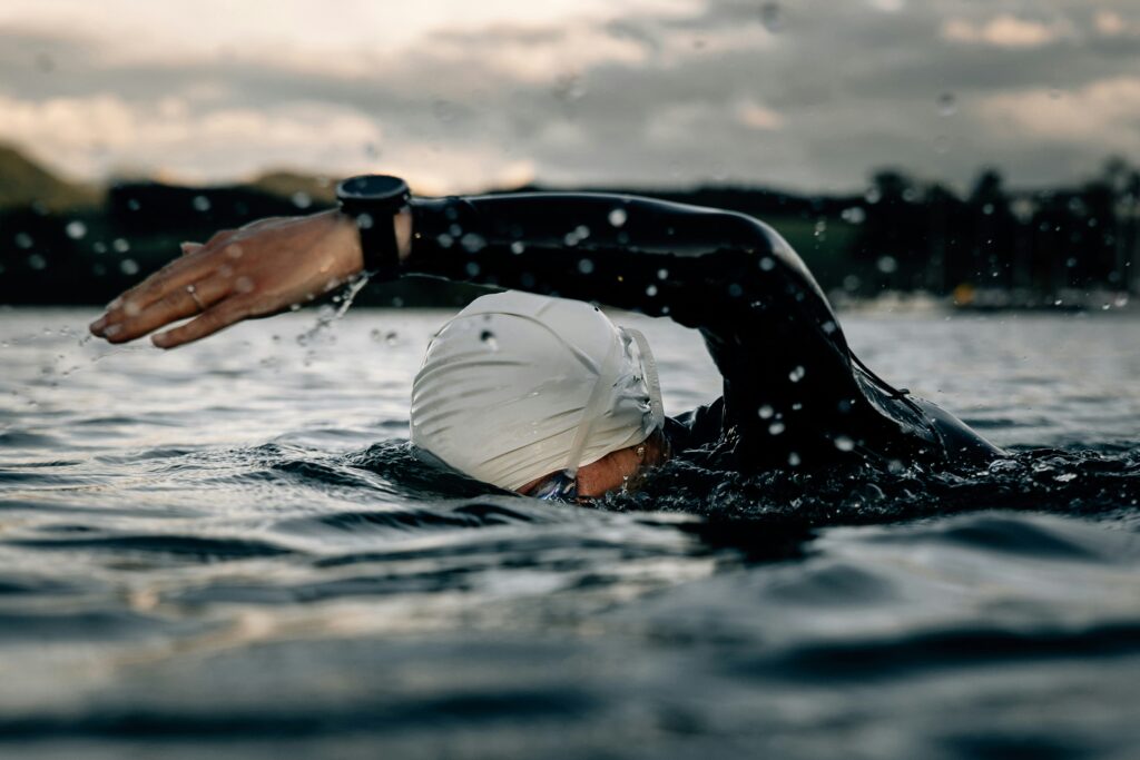 Triathlete practicing open water swimming to build confidence and prepare for race day