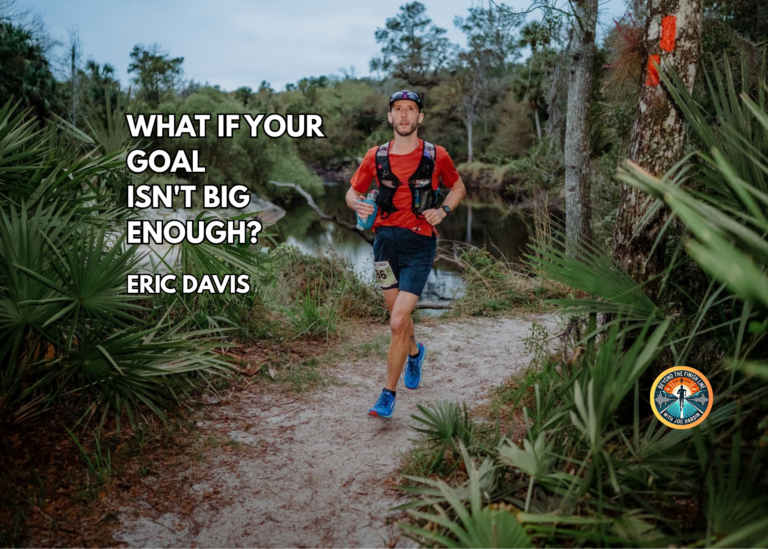 Ultrarunner Eric Davis smiling while trail running through the jungle