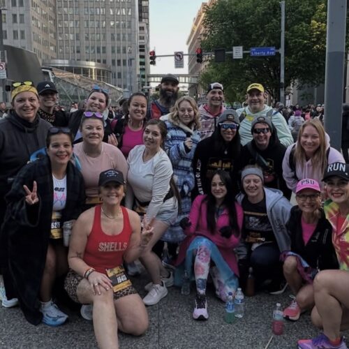 Jason Bahamundi runs the 2026 Pittsburgh Marathon in a bright pink shirt during the Everyday Athlete Run Club Tour.